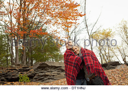 http://l450v.alamy.com/450v/dt1hnj/a-couple-man-and-woman-on-a-day-out-in-autumn-sharing-a-picnic-rug-dt1hnj.jpg